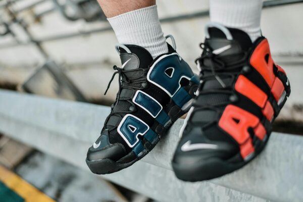 Dynamic close-up shot of colorful sports shoes showcasing bold design on urban backdrop.